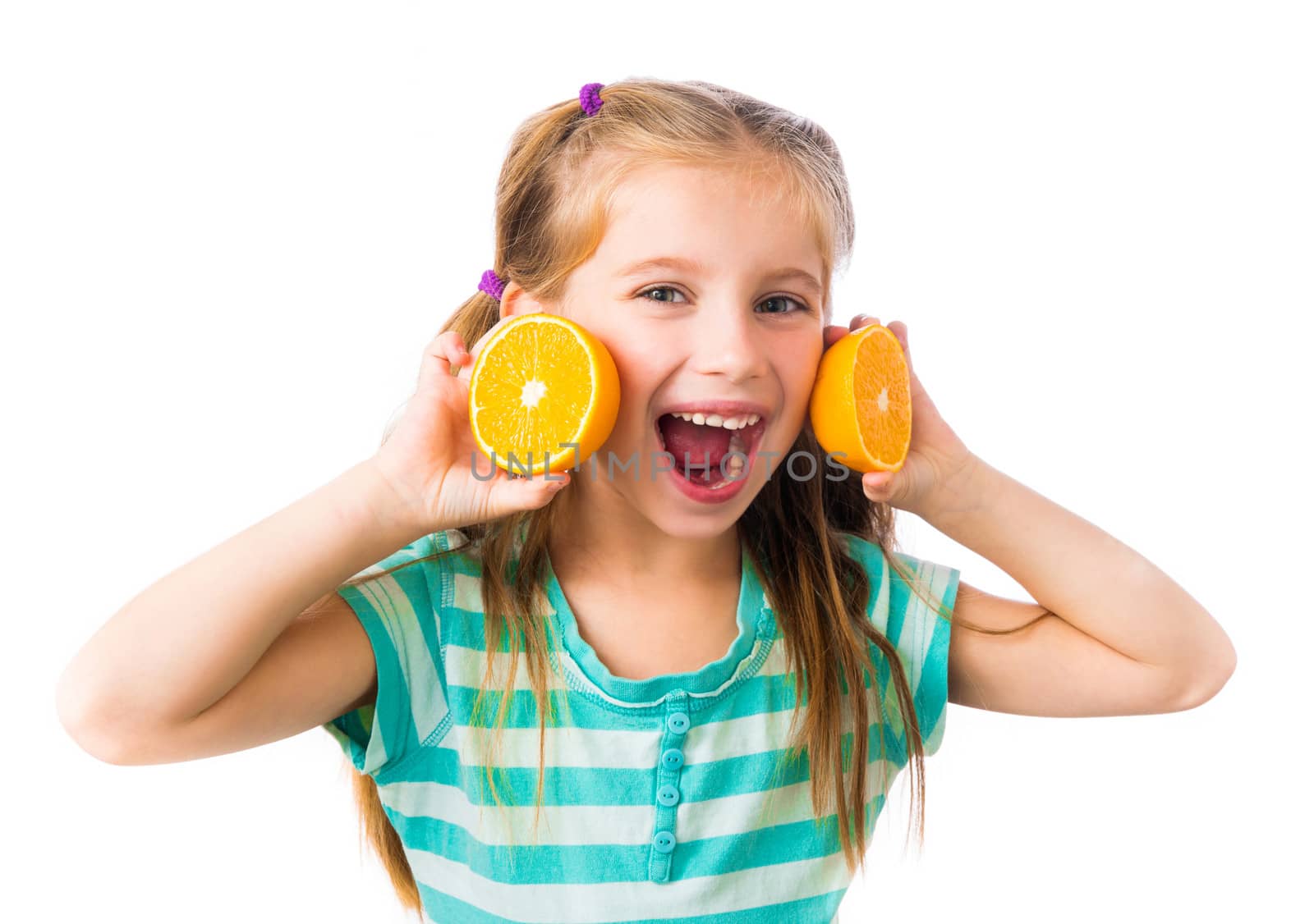 little smiling girl with two halves of oranges isolated on white background