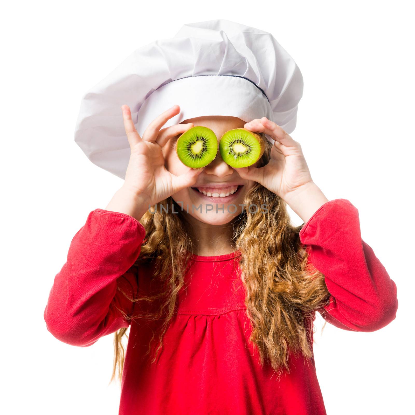 little girl in chef hat with dvemya rugs kiwi on eyes on white background