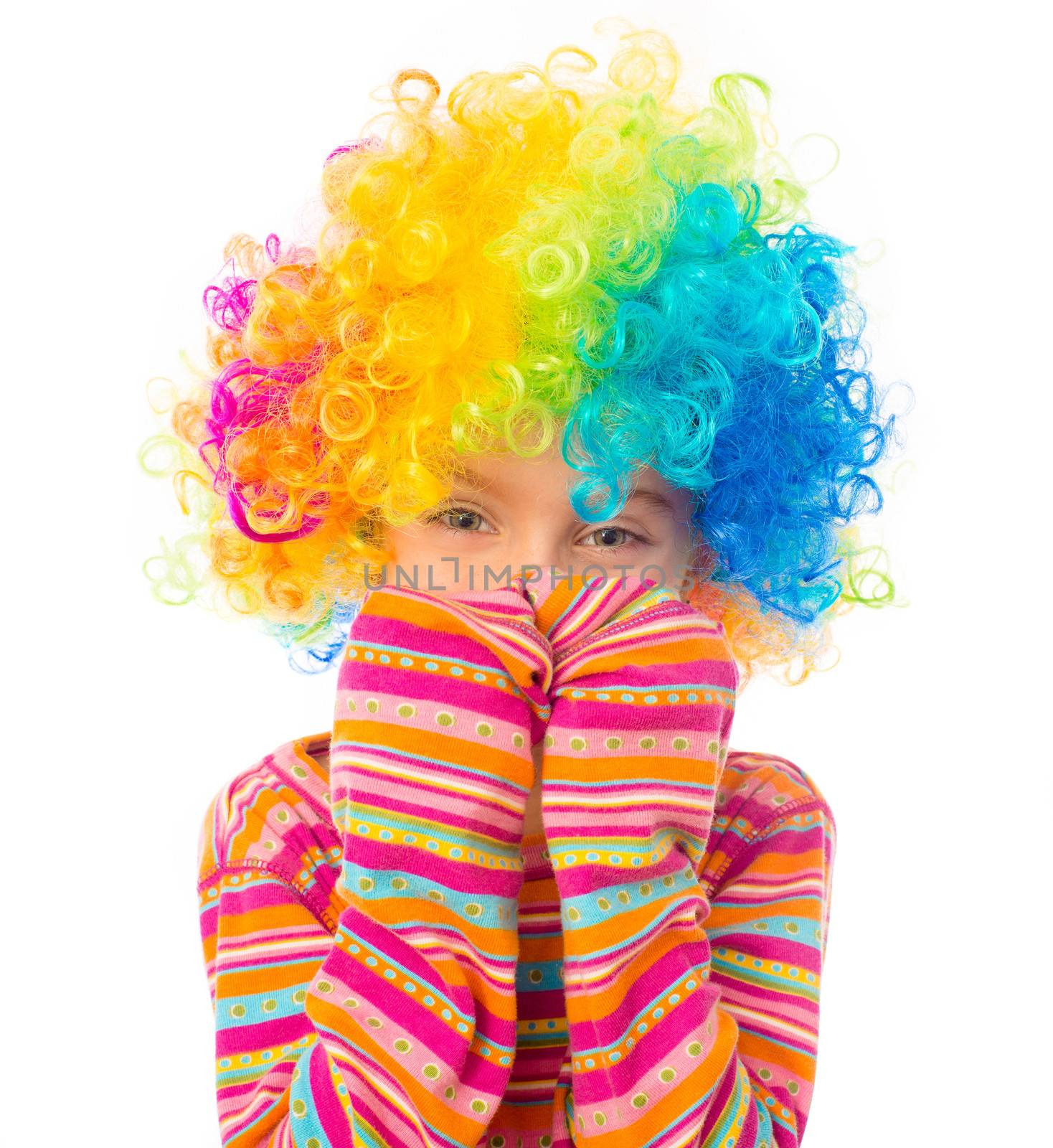 cute little girl in clown wig isolated on white background