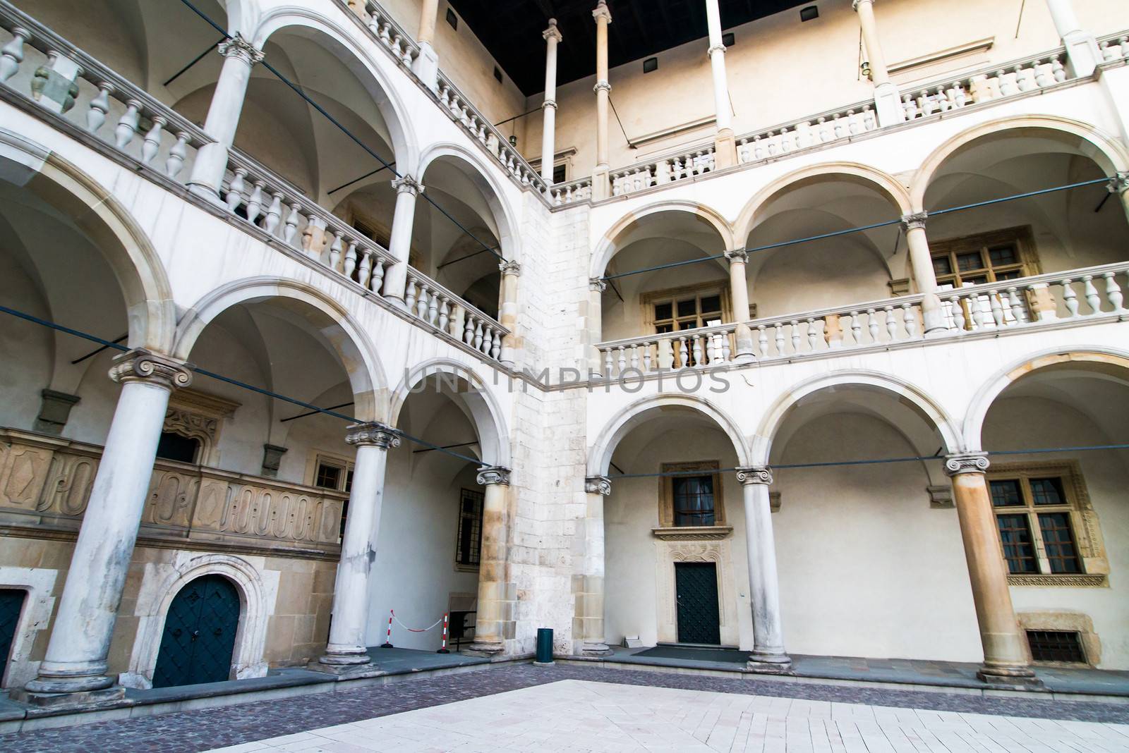 KRAKOW, POLAND - AUGUST 24: inner yard of royal palace in Wawel on August 24, 2013 in Krakow, Poland. The monument to the history of the Decree of the President Lech Walesa on September 8, 1994.