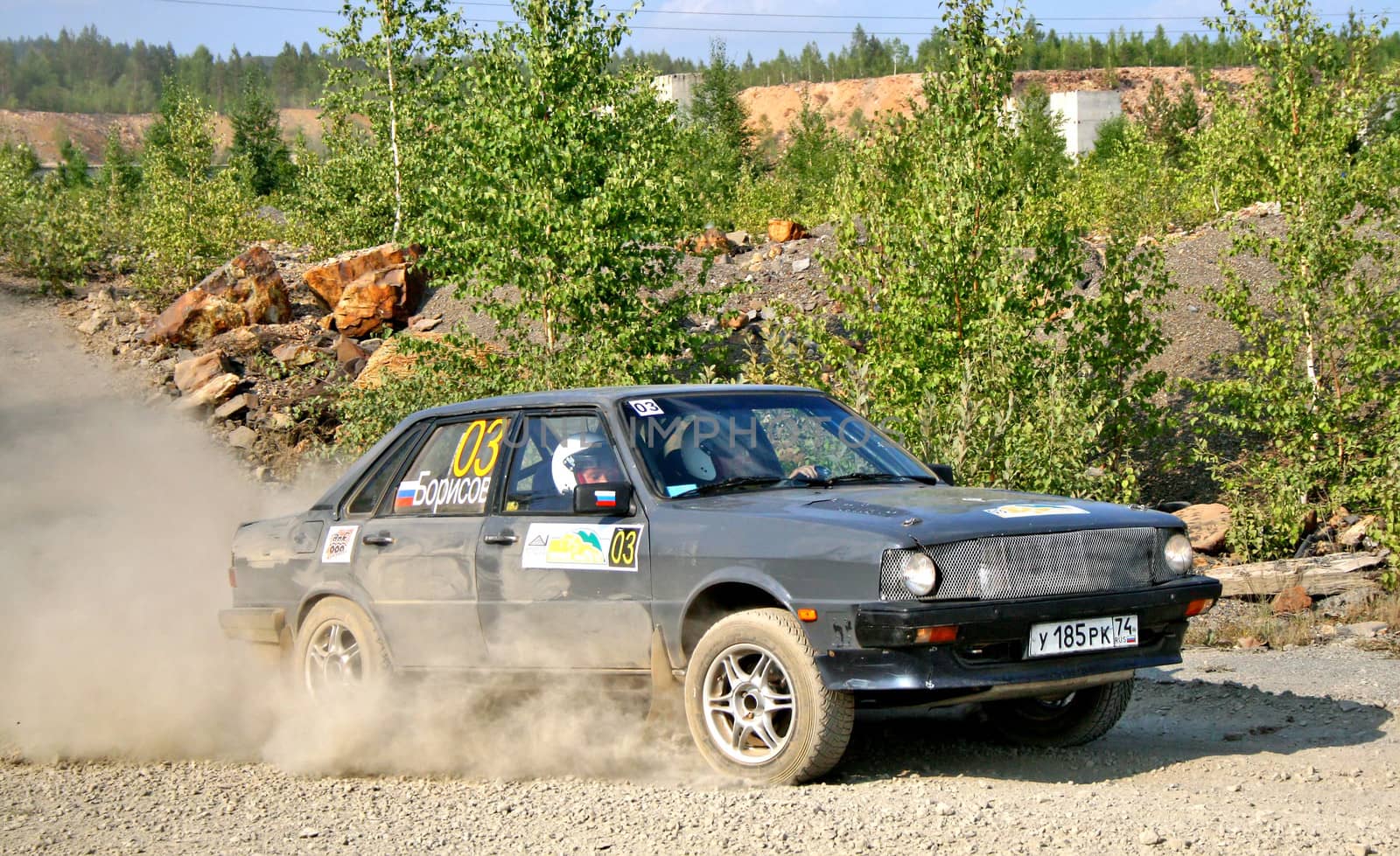 BAKAL, RUSSIA - AUGUST 13: Viktor Borisov's Audi 80 (No. 03) competes at the annual Rally Southern Ural on August 13, 2010 in Bakal, Satka district, Chelyabinsk region, Russia.