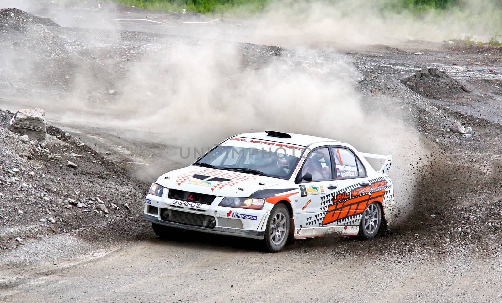 BAKAL, RUSSIA - JULY 21: Andrey Trukhin's Mitsubishi Lancer Evo VII (No. 1) competes at the annual Rally Southern Ural on July 21, 2012 in Bakal, Satka district, Chelyabinsk region, Russia.