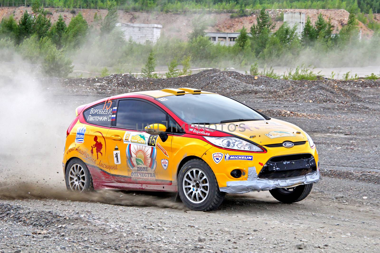 BAKAL, RUSSIA - JULY 21: Ivan Vorobyov's Ford Fiesta (No. 15) competes at the annual Rally Southern Ural on July 21, 2012 in Bakal, Satka district, Chelyabinsk region, Russia.