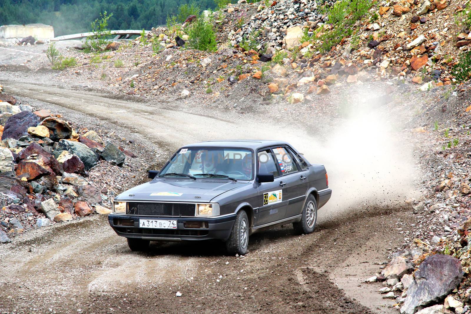 BAKAL, RUSSIA - AUGUST 21: Konstantin Berezin's Audi 80 (No. 59) competes at the annual Rally Southern Ural on August 21, 2012 in Bakal, Satka district, Chelyabinsk region, Russia.