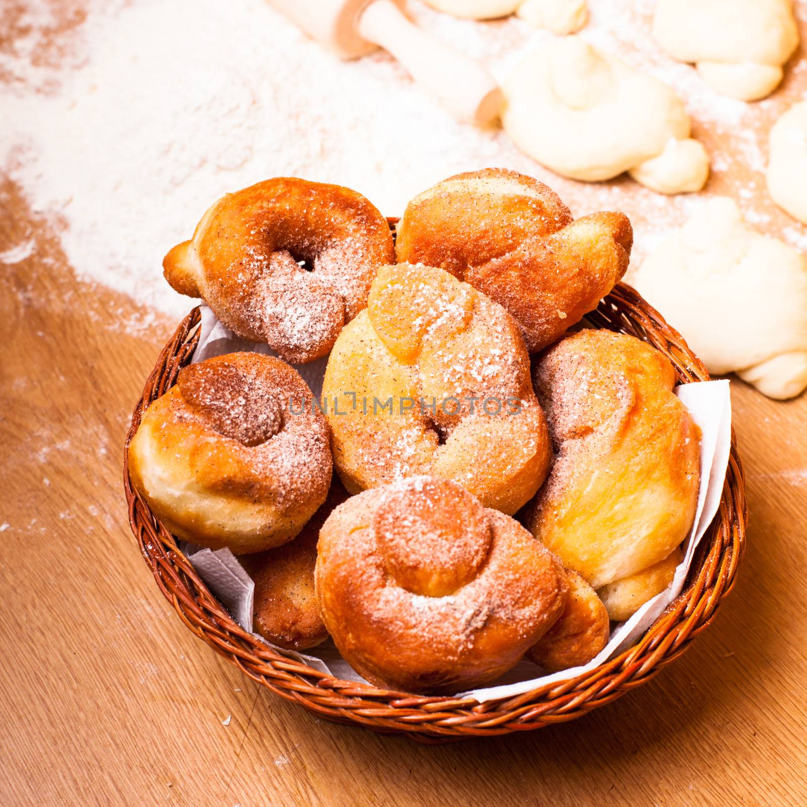 Fresh donats with sugar powder and prepared dough