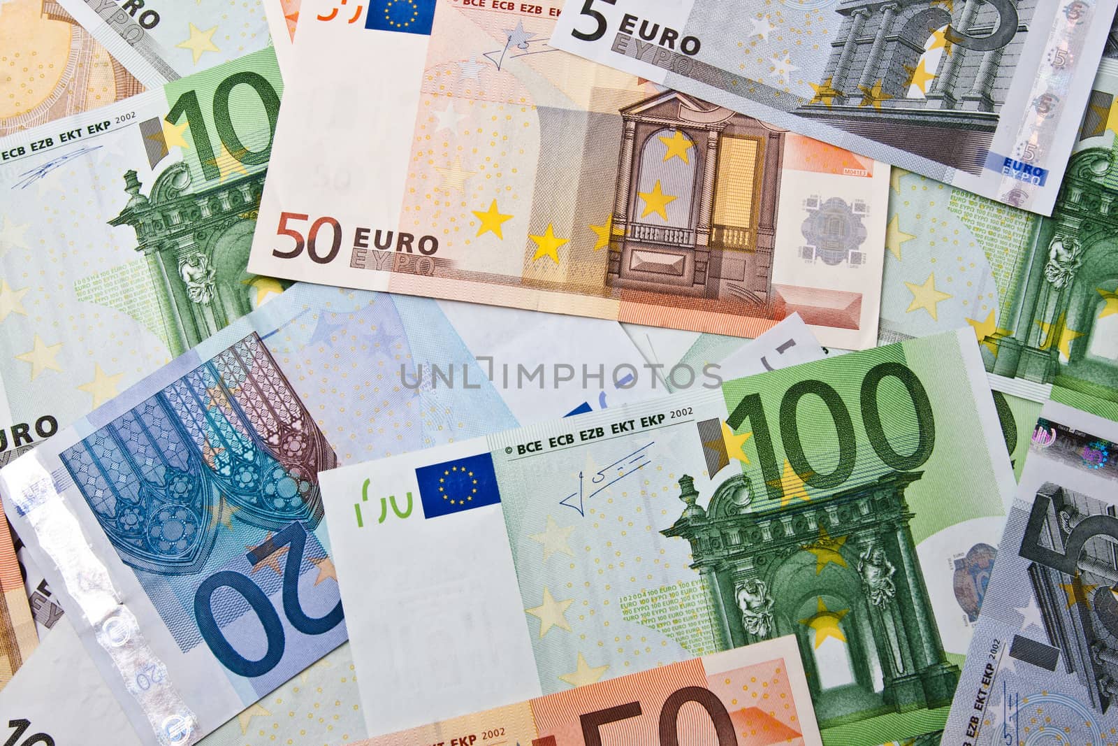 Many euro banknotes making european currency background