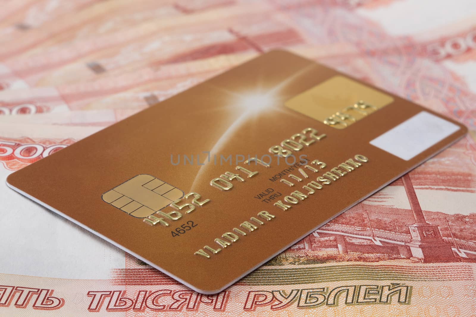 
credit card on the background of banknotes