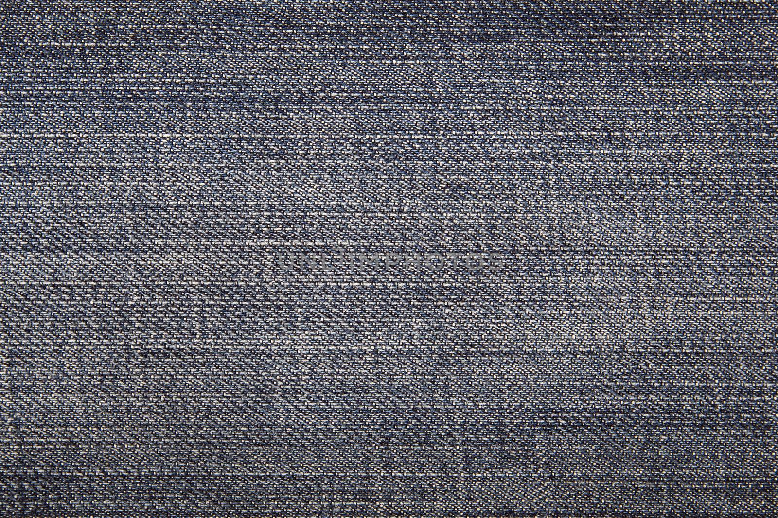 The worn, blue jeans, a textile background