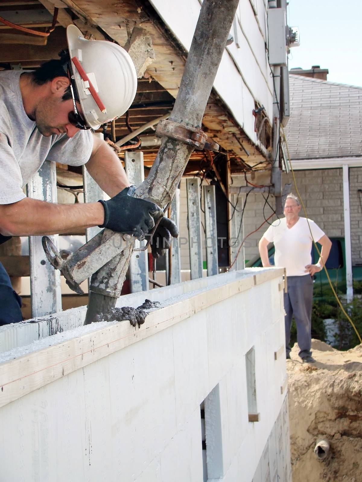 Pouring concrete in styrofoam foundation by Mirage3