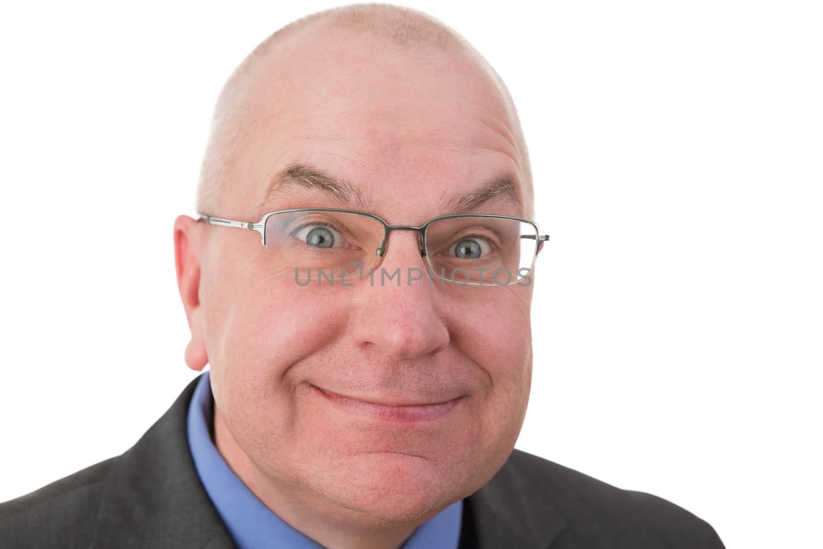 Zealous businessman with a fanatical expression grinning at the camera with his eyes opened wide in expectation that the viewer will agree with him, head and shoulders portrait on white