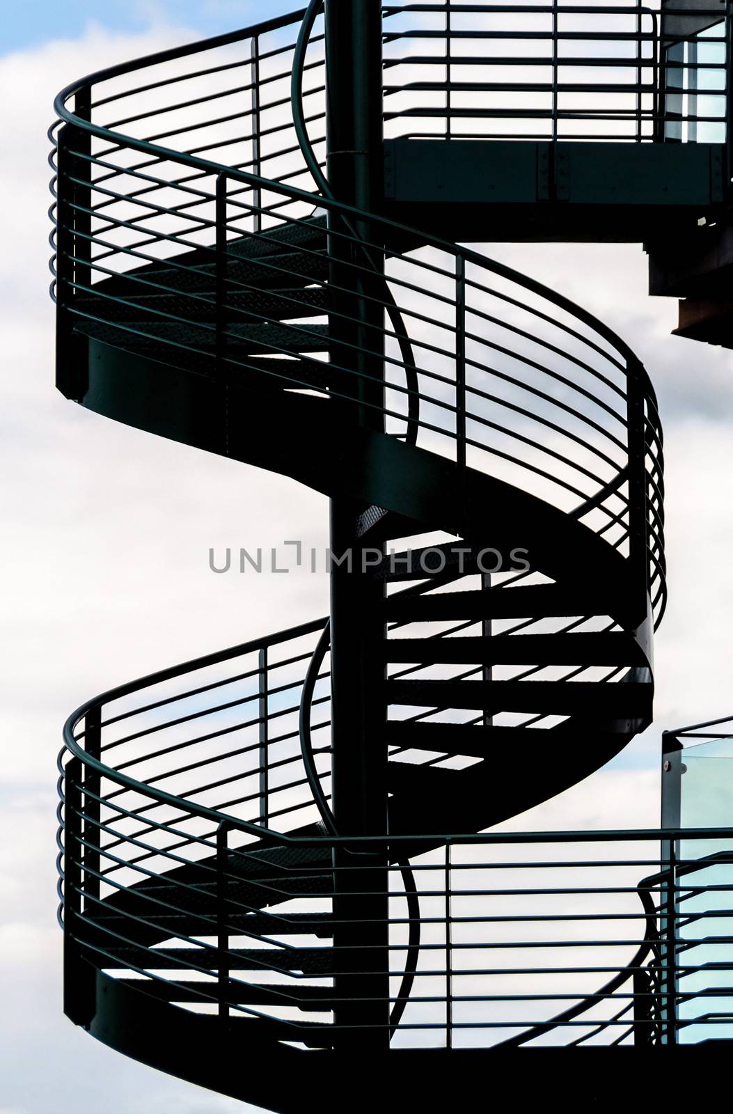 Spiral staircase and sky background