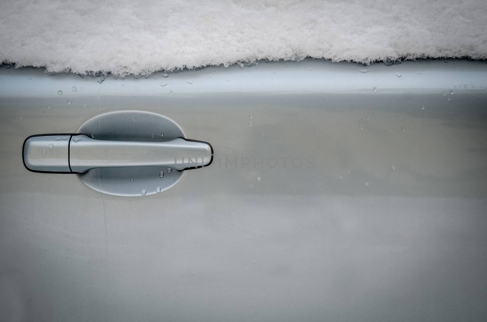 Winter Image Of Snow On A Car Door