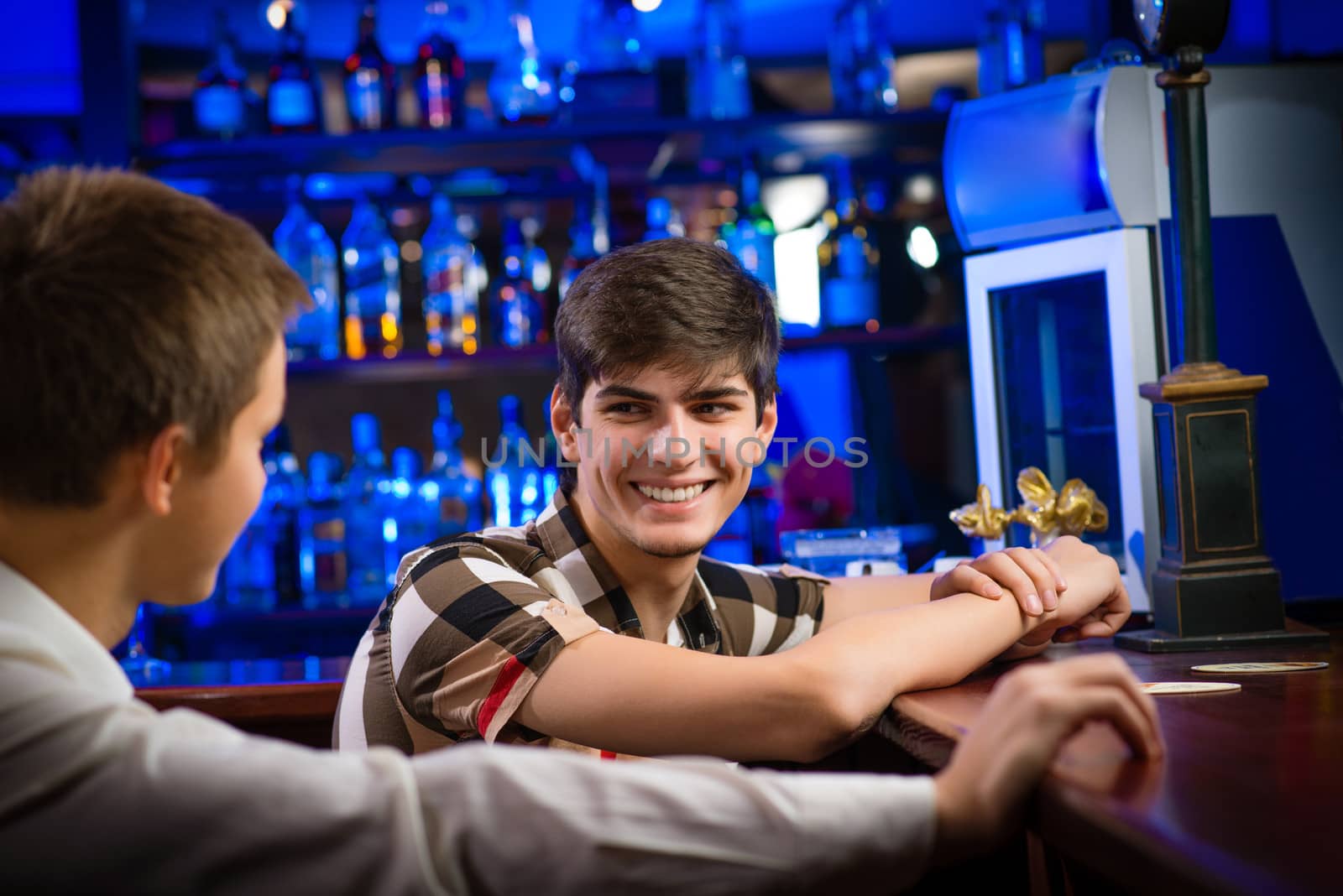 portrait of a young man at the bar, fun nightlife