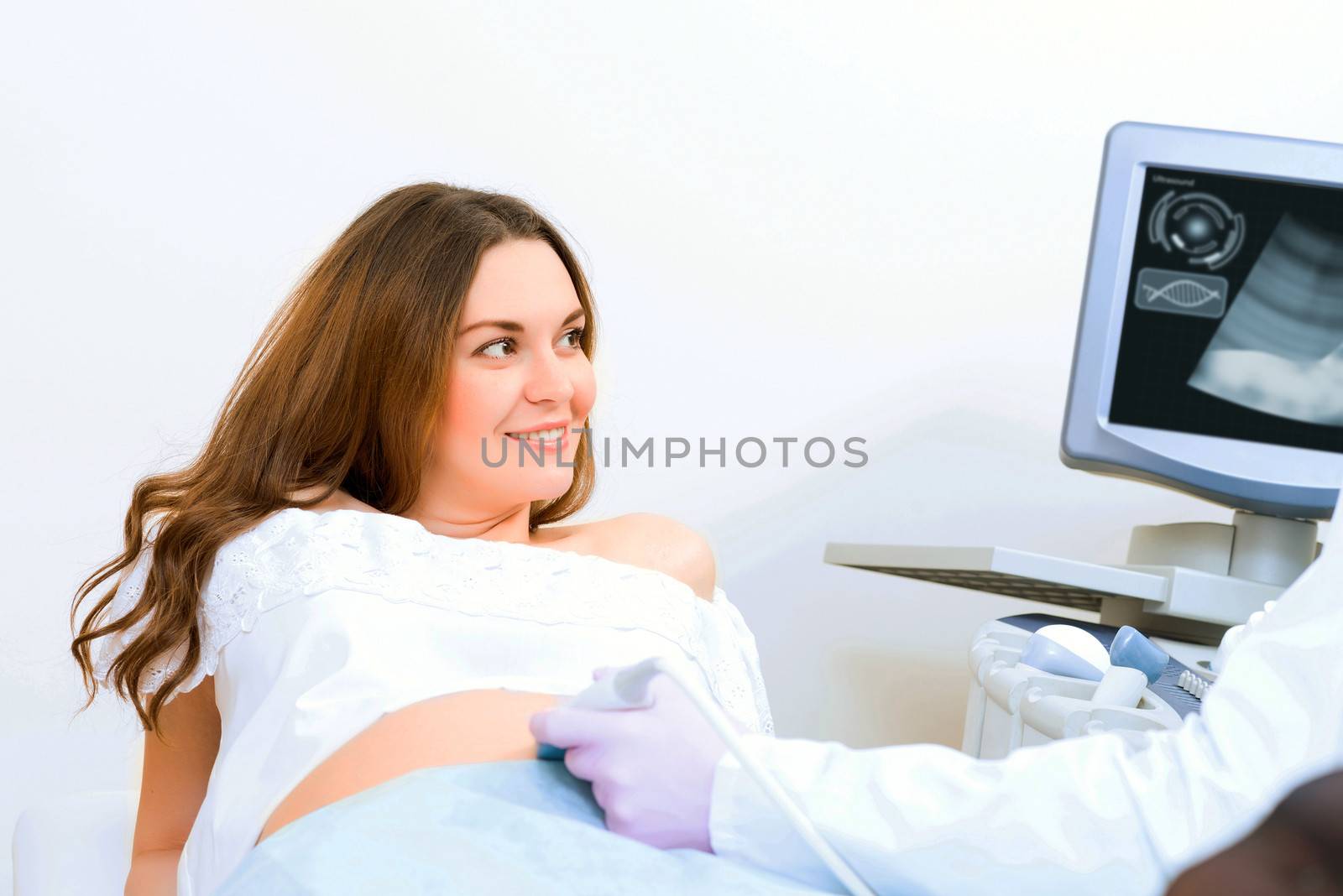 Young attractive pregnant woman on reception at the doctor, health check