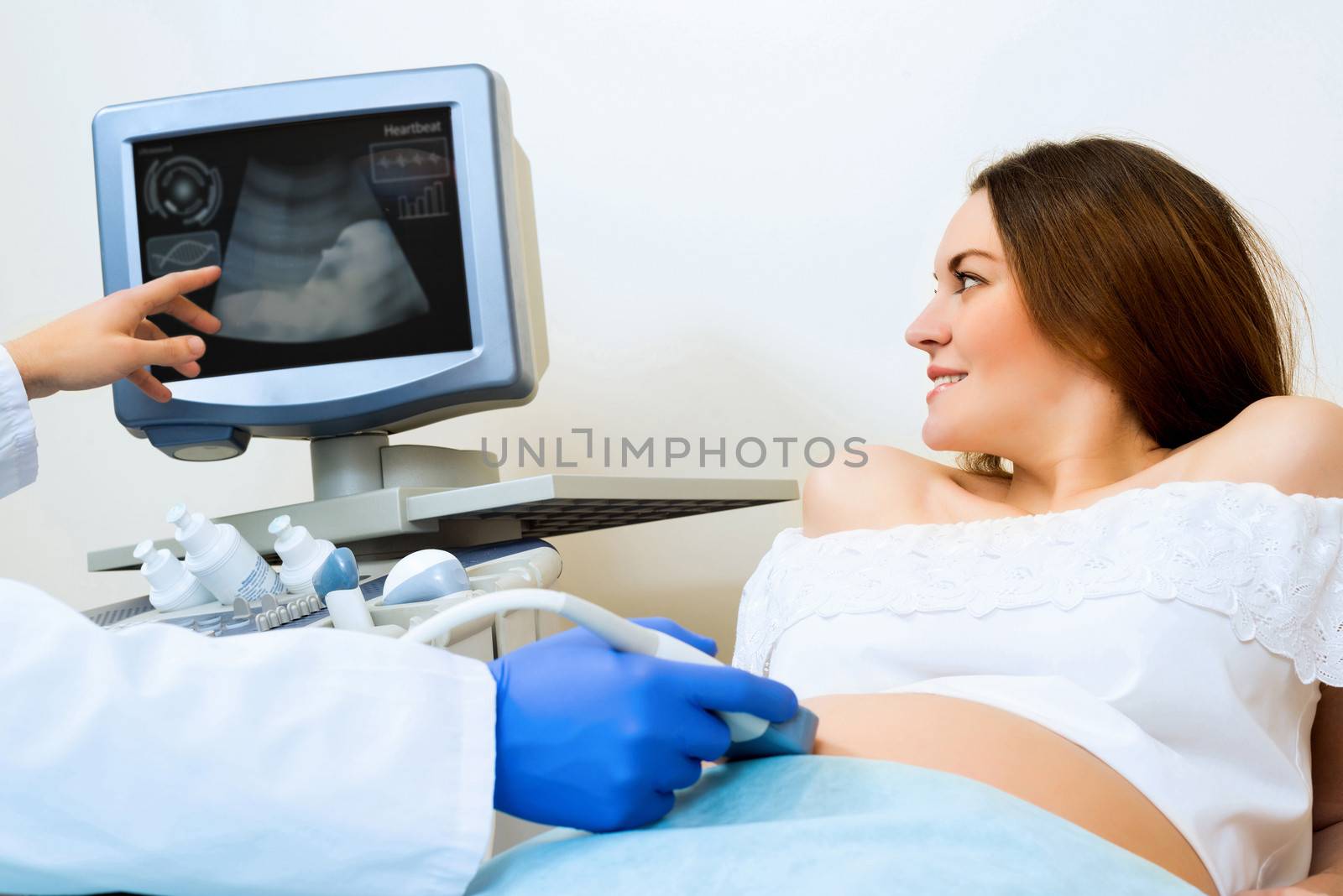 young pregnant woman on the ultrasound, health check