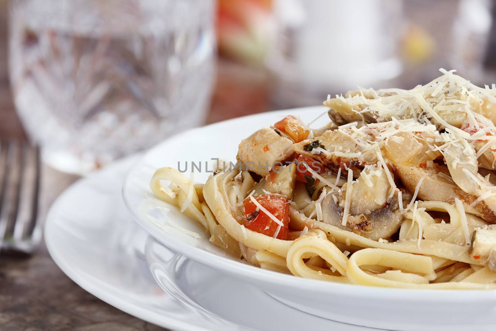 Chicken linguine with grilled chicken, tomatoes, mushrooms and freshly grated parmesan cheese.