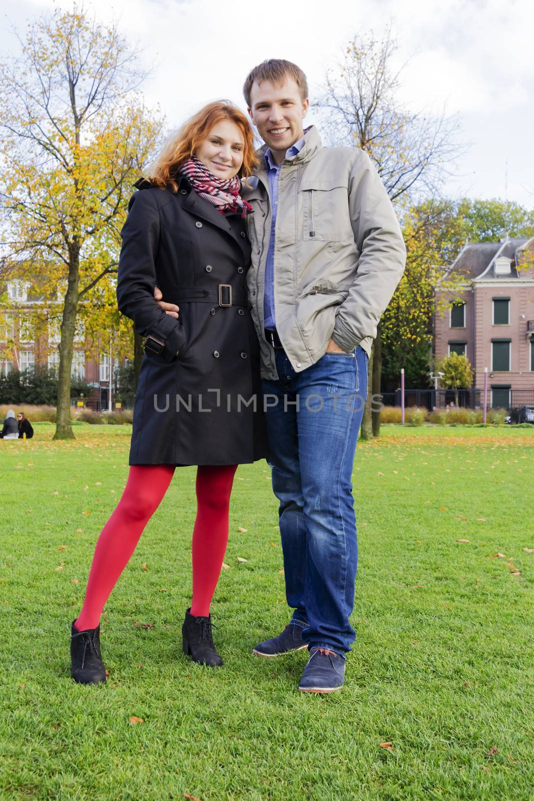 Outdoor happy couple in love, Museum Plein, autumn Amsterdam background