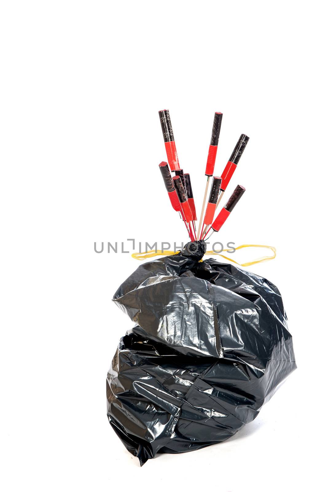 a garbage bag with old fireworks, on new years day