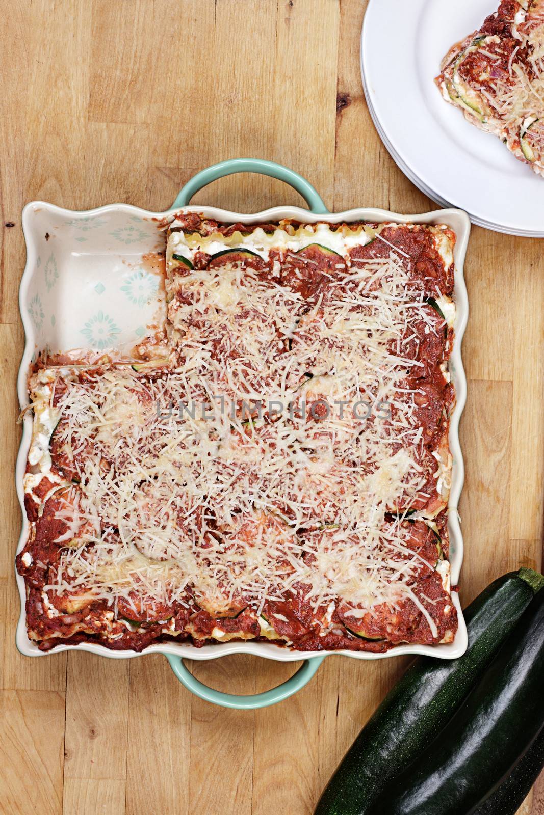 Delicious zucchini lasagna with a slice missing. 