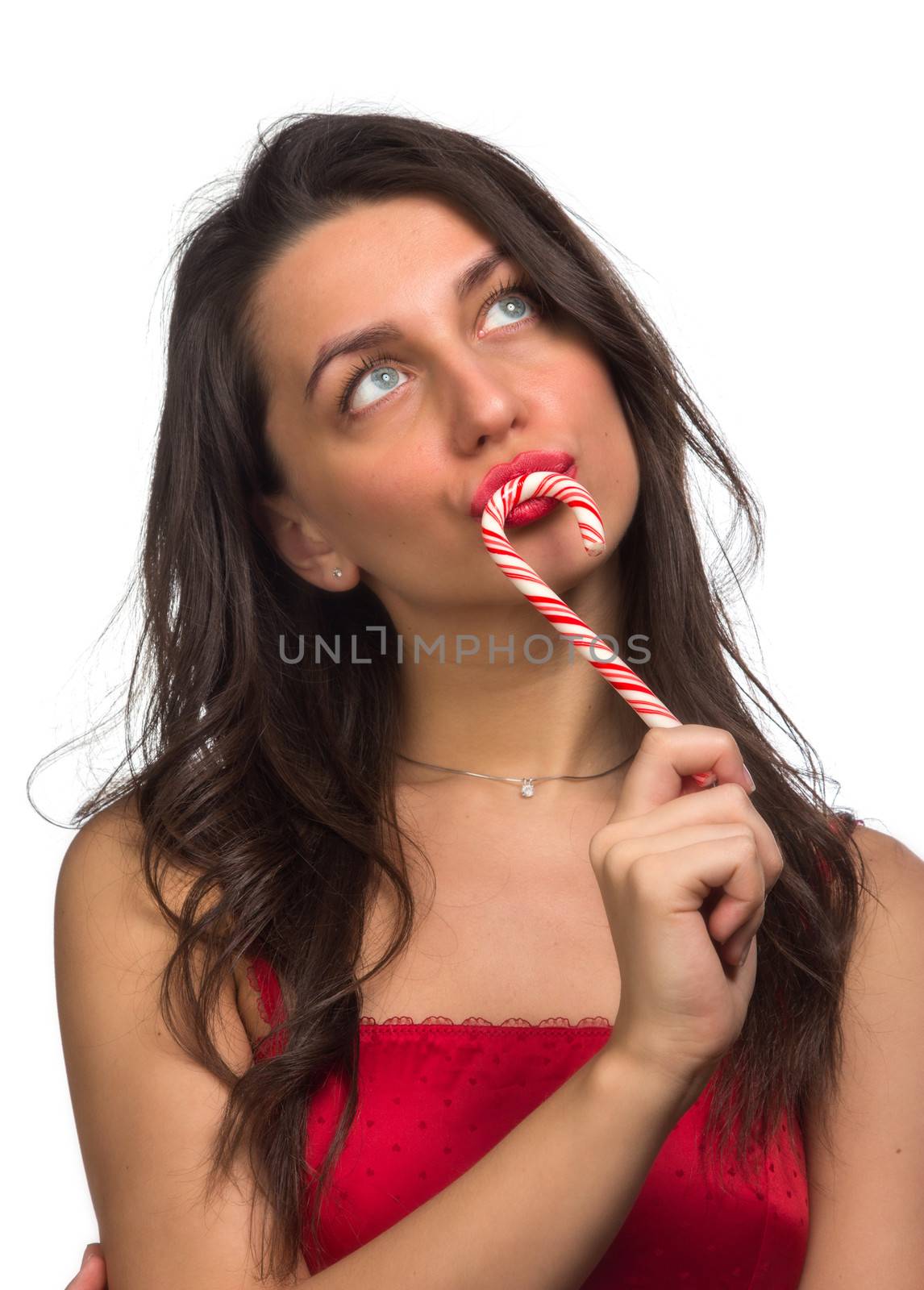 girl lick white-red candy in the form of heart with beautiful make-up   Valentine's day, love.