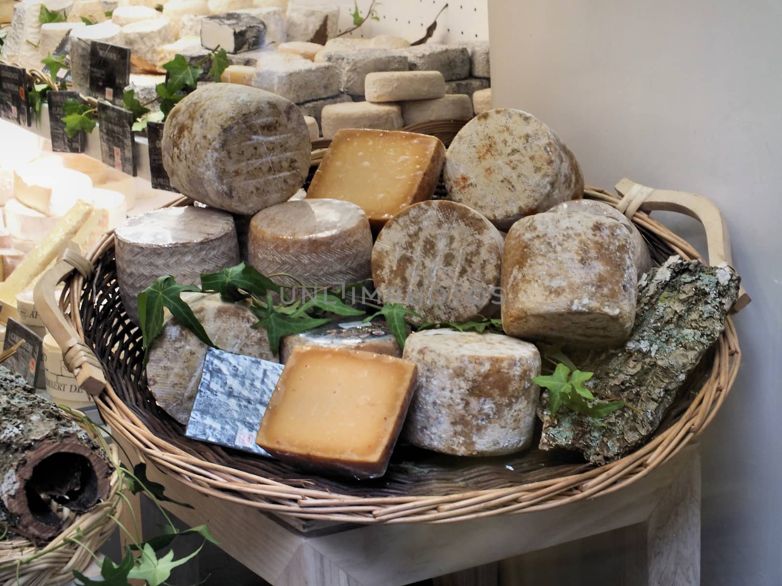 Various cheeses on display at a Parisian fromagerie (cheese shop).