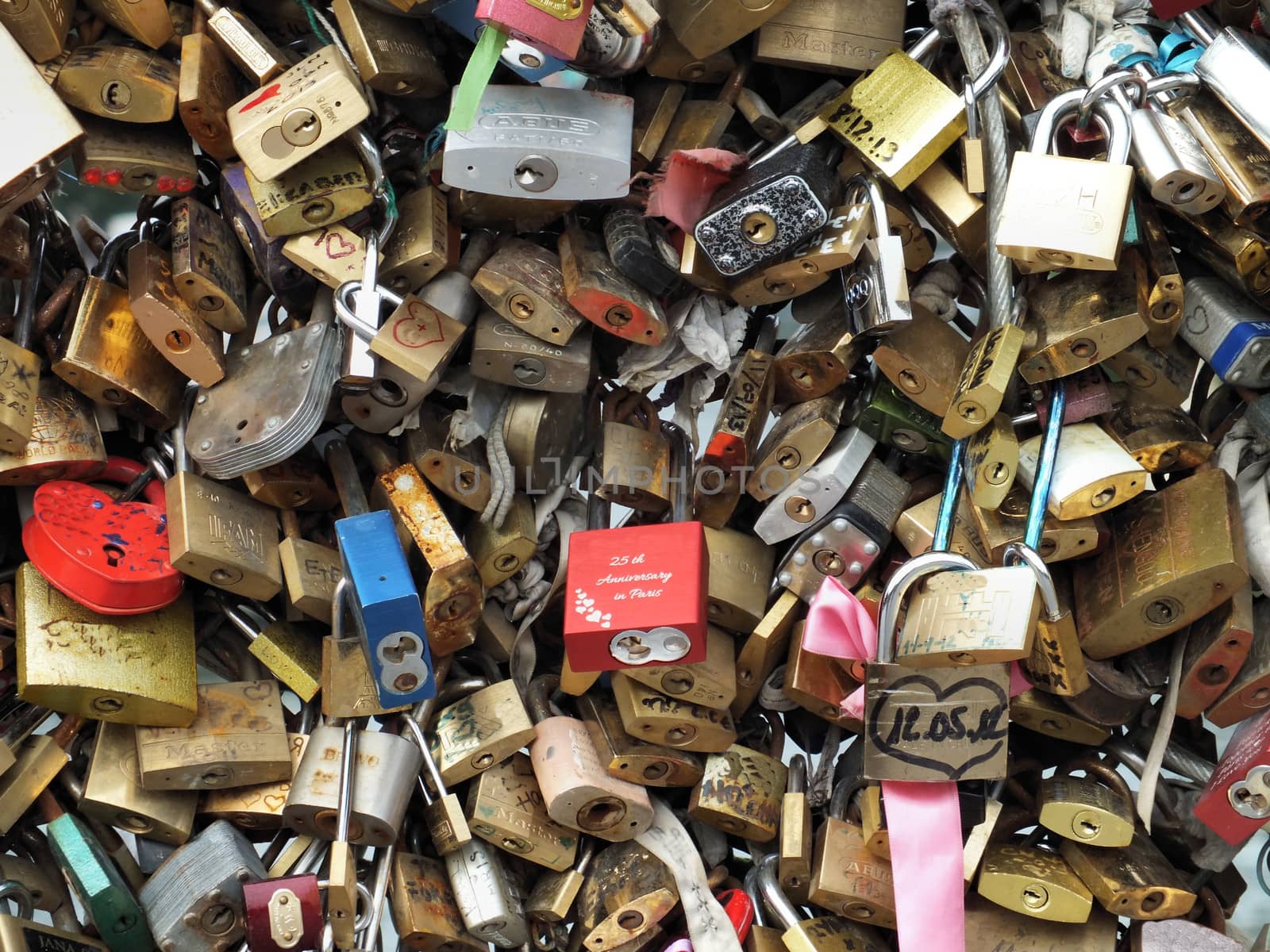 A love lock is a padlock which sweethearts lock to a bridge to symbolise their love and usually their' names or initials are inscribed on it. The key is then thrown away to symbolise unbreakable love.
