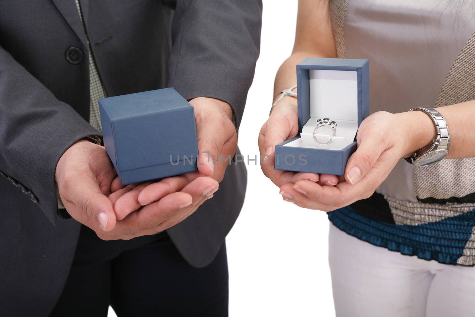 Couple hands holding boxes with rings. Valentines day and engage by dacasdo