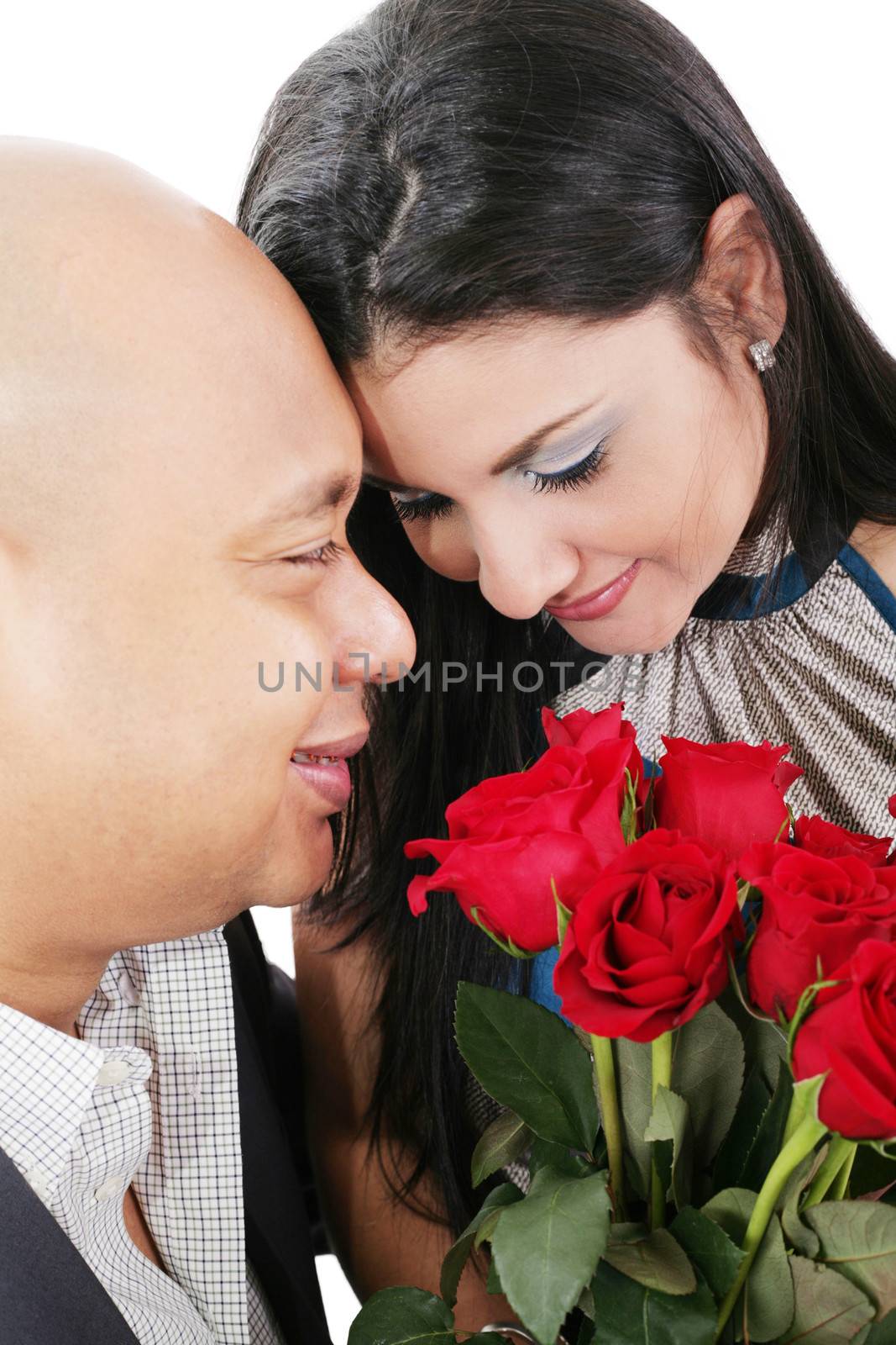 Close up of couple holding a bouquet of red roses