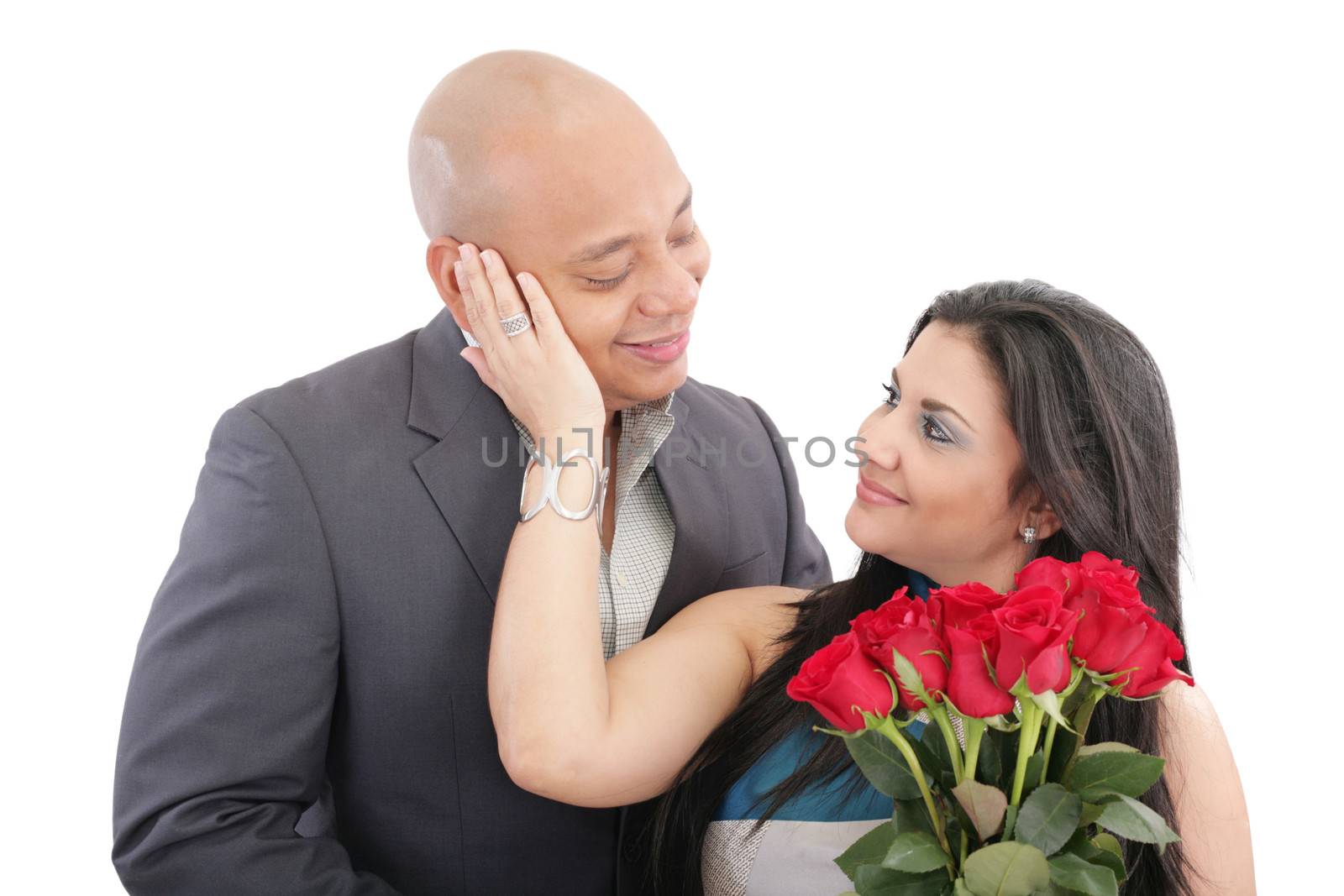 Happy woman receiving a bouquet of red roses of her lover