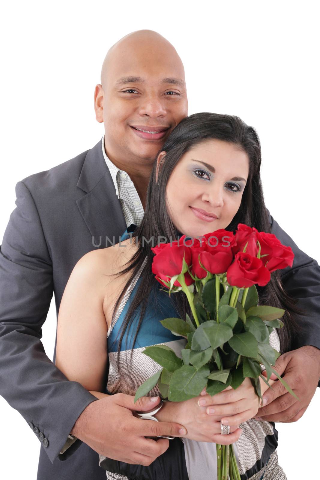 Portrait of happy couple with flowers, looking at camera.