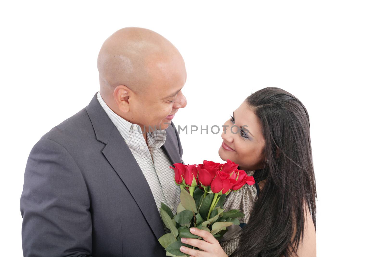 man giving a bouquet of red roses to his pretty girlfriend by dacasdo