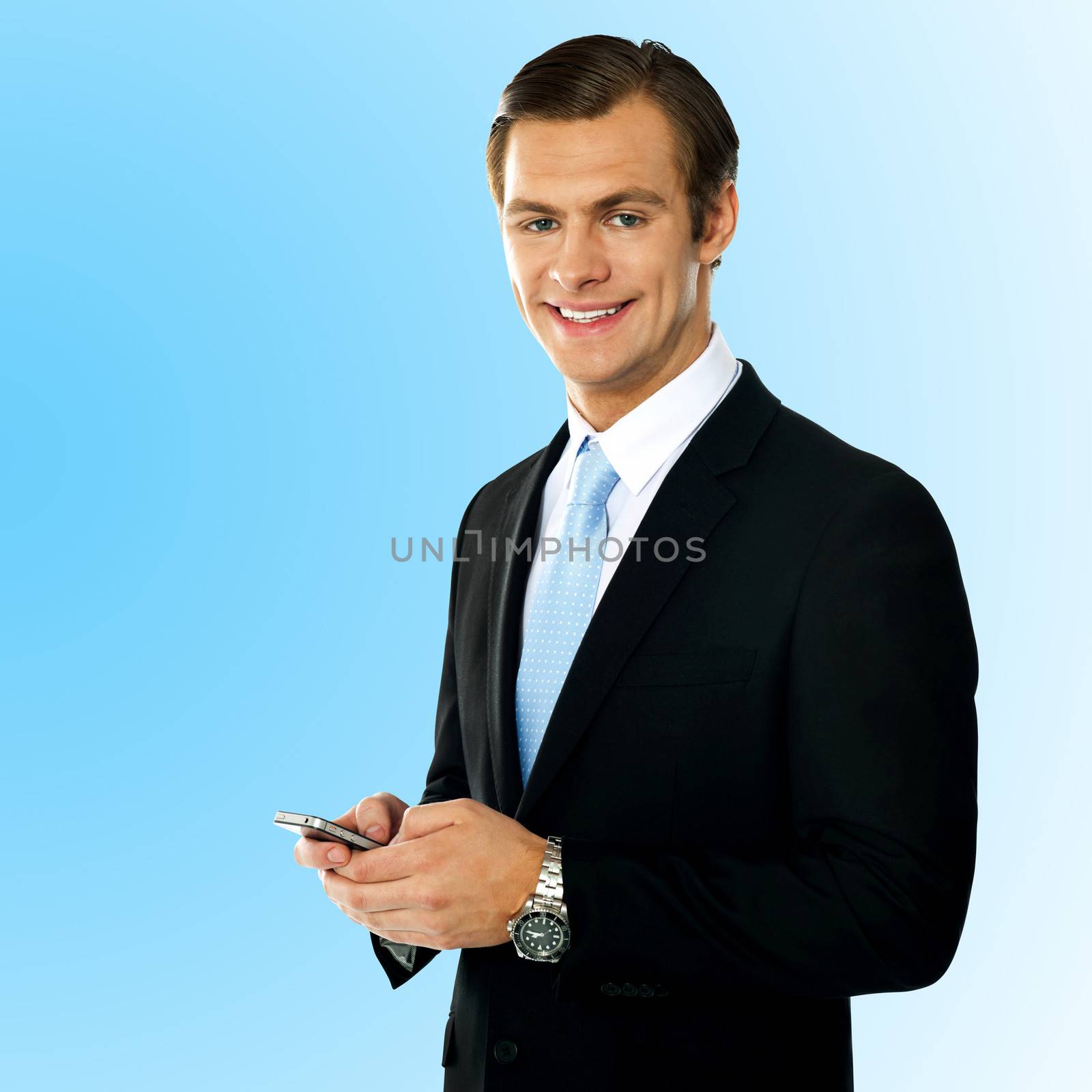 Corporate guy sending text message