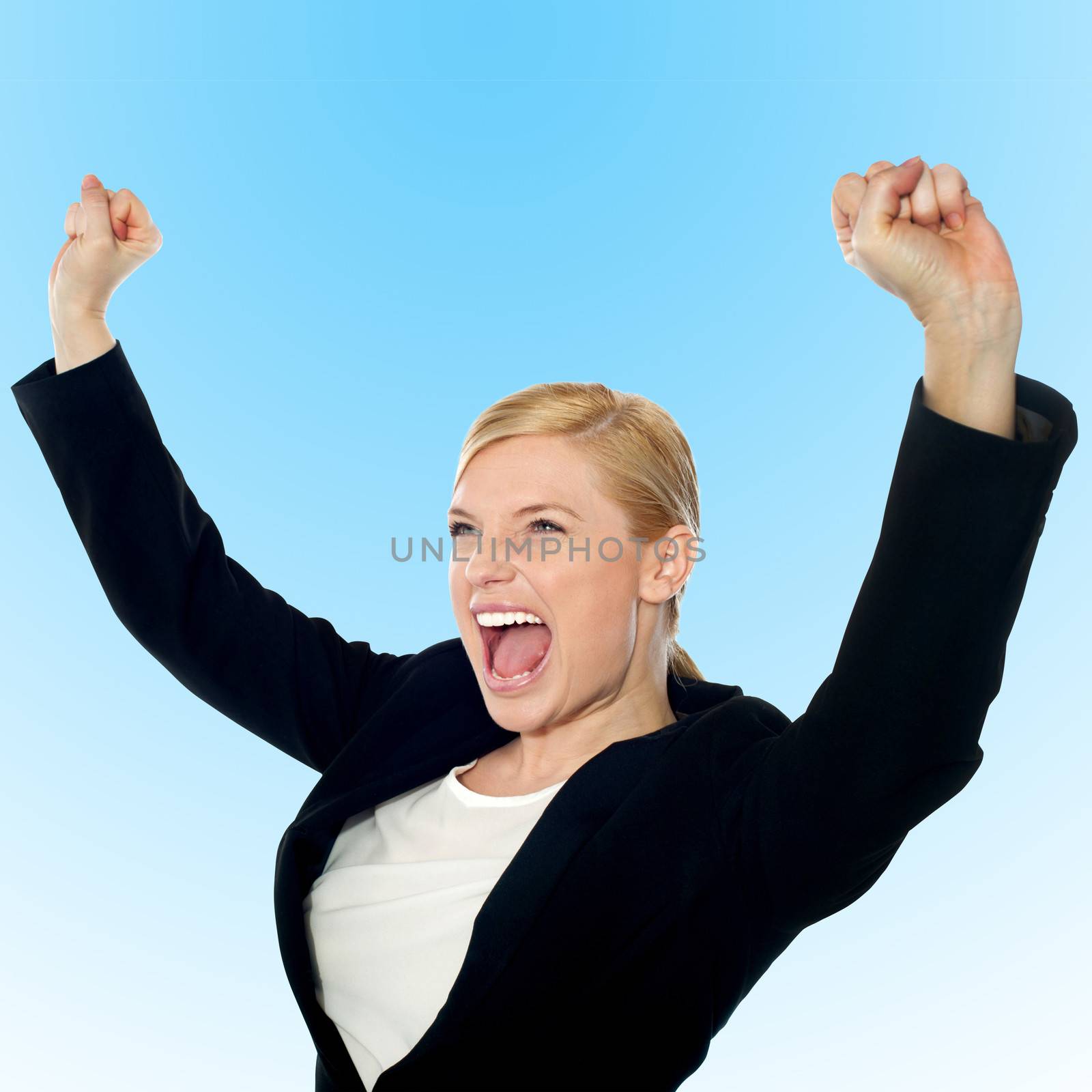 Businesswoman raising her arms in excitement