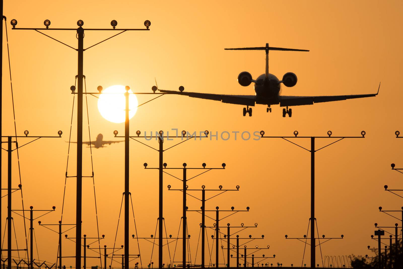 Airplane landing at Los Angeles International Airport during sunset, Los Angeles, California, USA