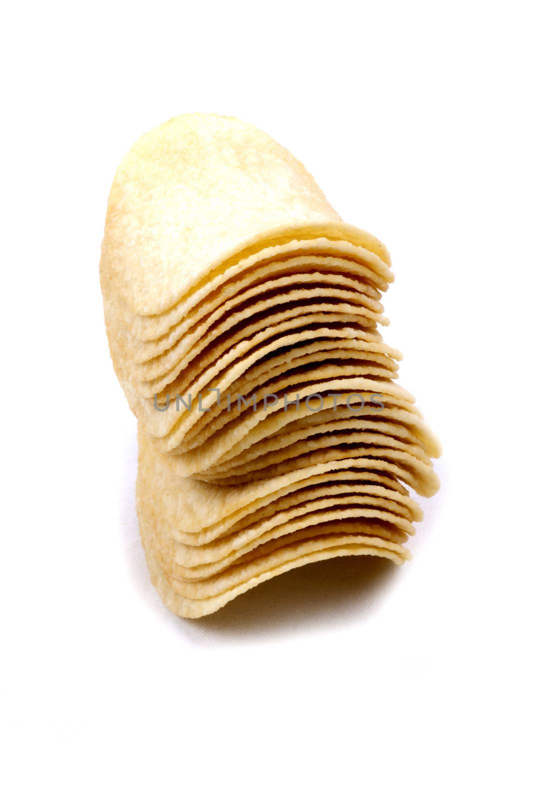 Tasty potato crisps (chips) isolated on a white background