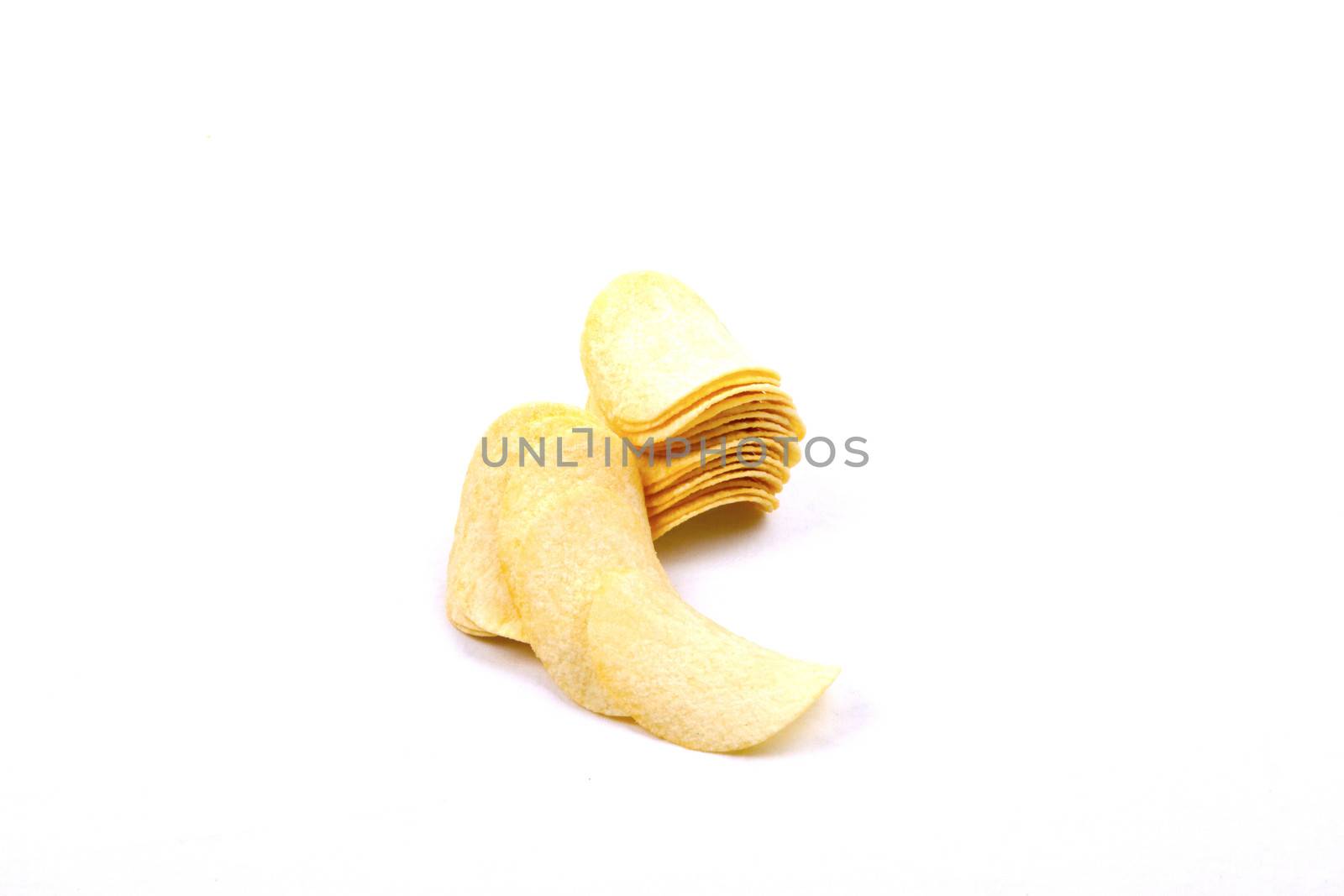 Tasty potato crisps (chips) isolated on a white background