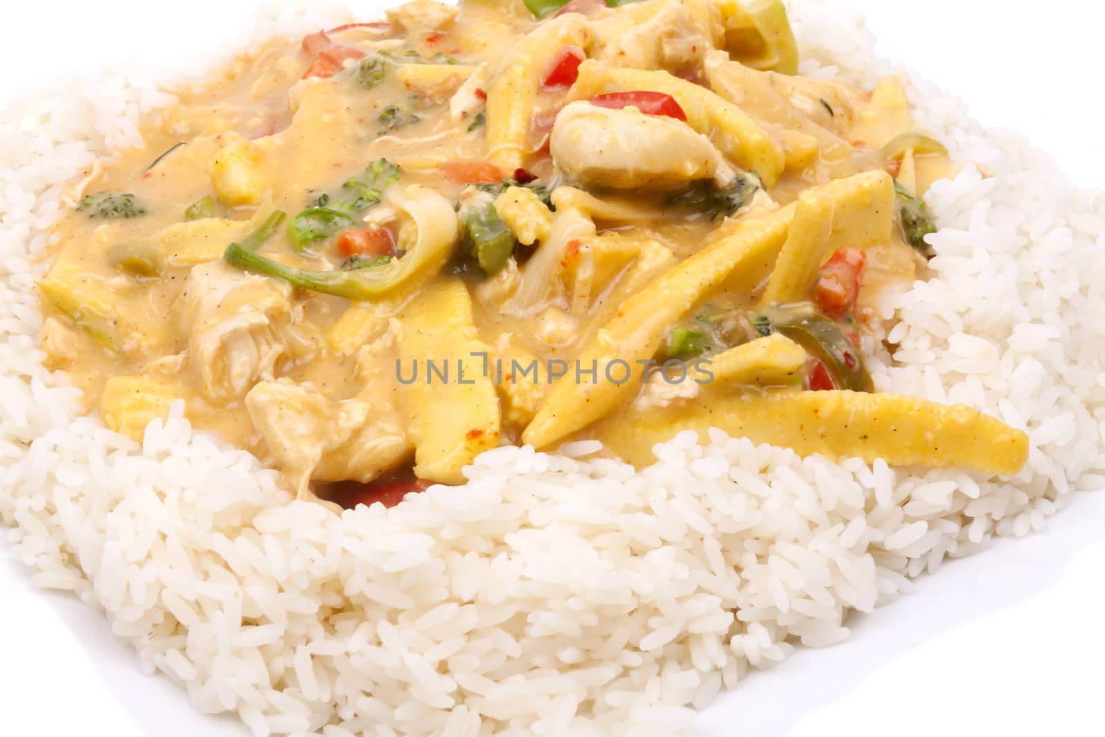 diced chicken in coconut curry sauce served with rice