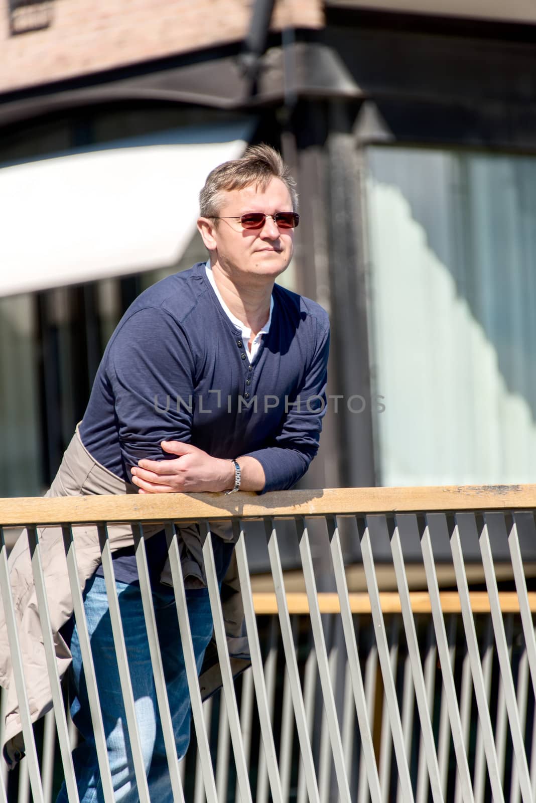 Man standing on bridge