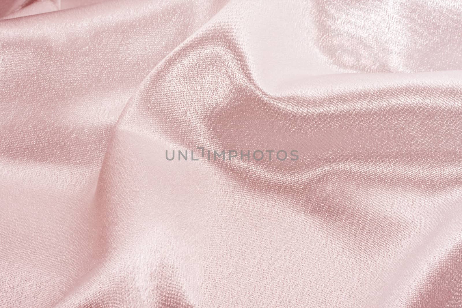 Abstract background pink silk fabric with beautiful waves