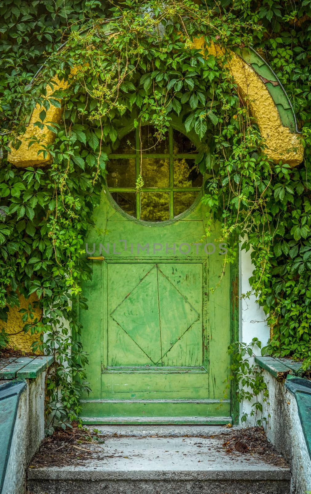Green Door Of Fairytale Cottage With Round Window