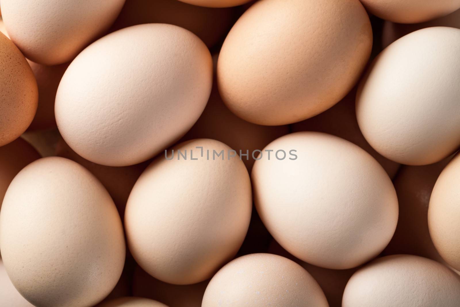 Eggs background. Fresh brown chicken eggs. Top view 