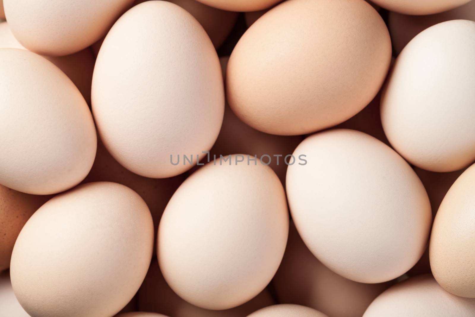 Fresh brown chicken eggs background. Top view