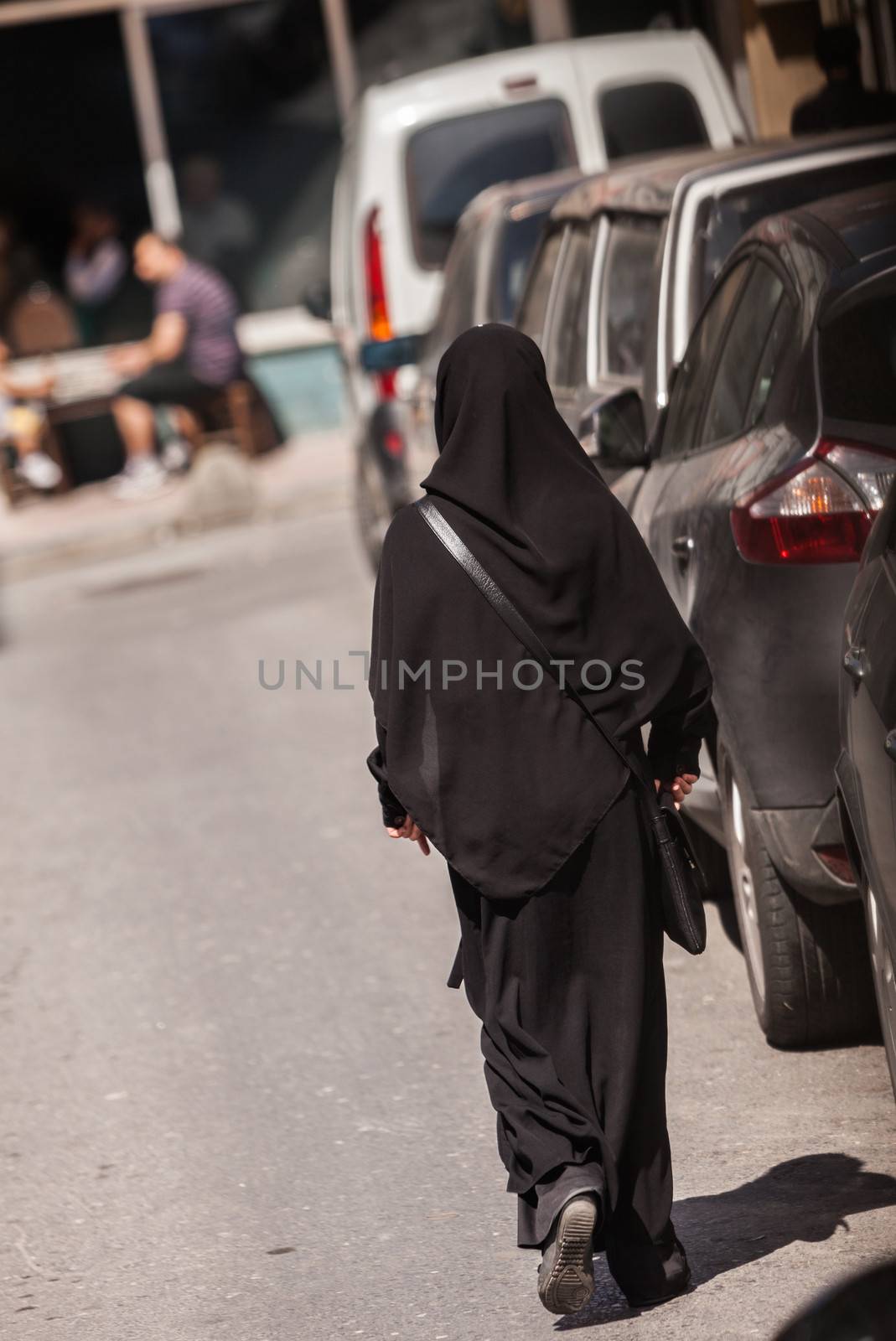 Muslim woman in Istanbul neighborhood wearing a hijab