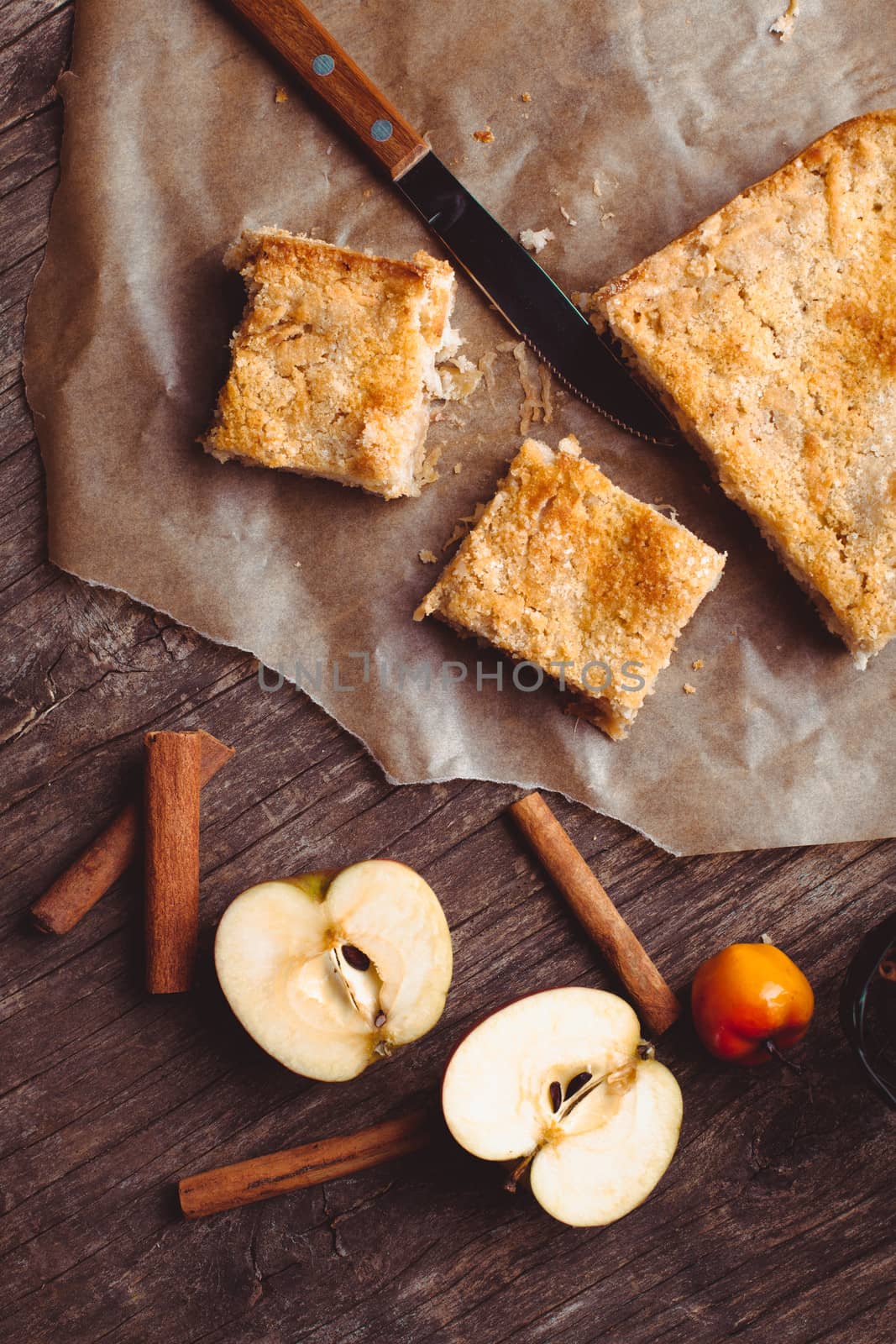 Apple cake with grated apples and cinnamon on the table