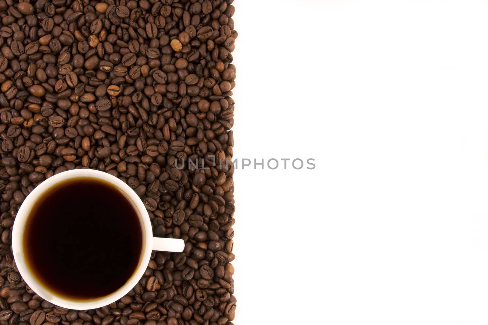 Coffee cup with coffee beans on a white background.