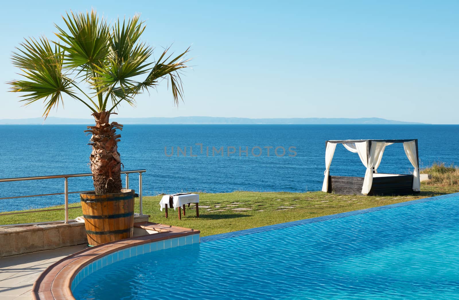 Blue water of swimming pool and the Black sea shore near Sozopol town, Bulgaria