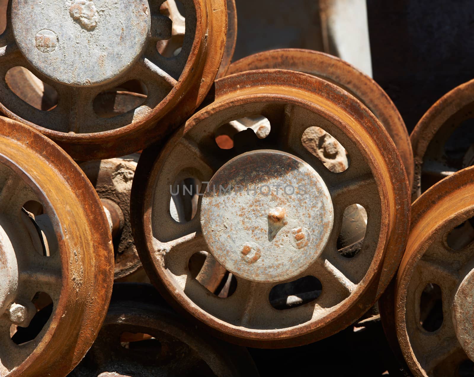 Rusty wheels of old Russian mine trolley