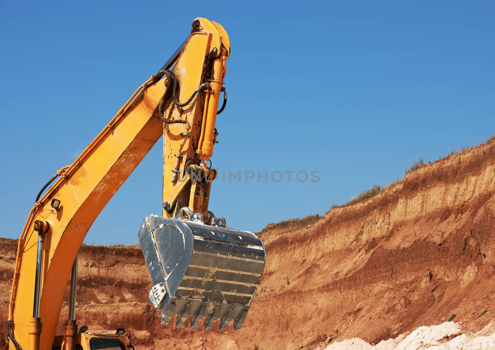 Excavator bucket in limestone mine