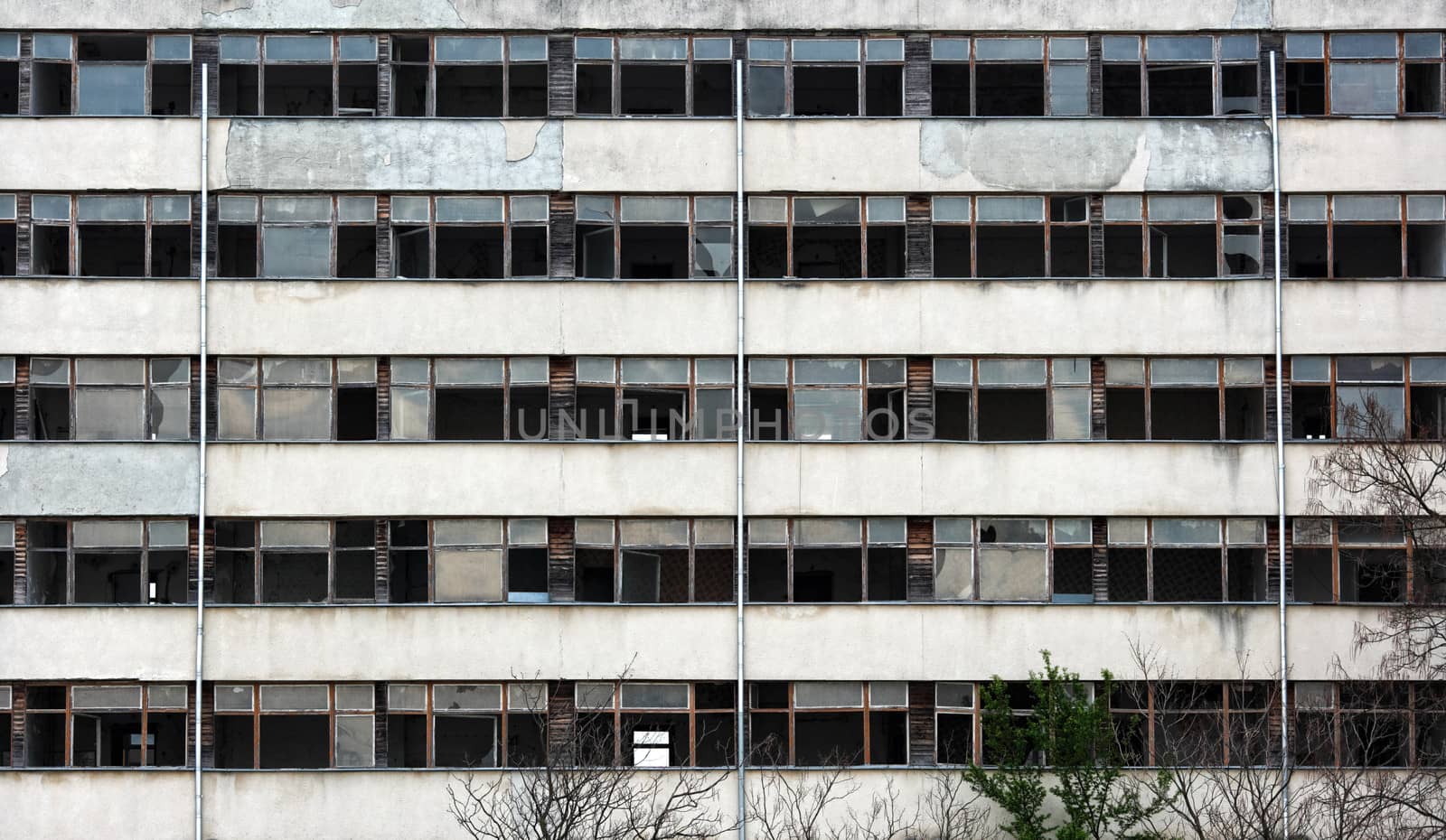 Broken windows of abandoned residental building in South Bulgaria near village of Debelt