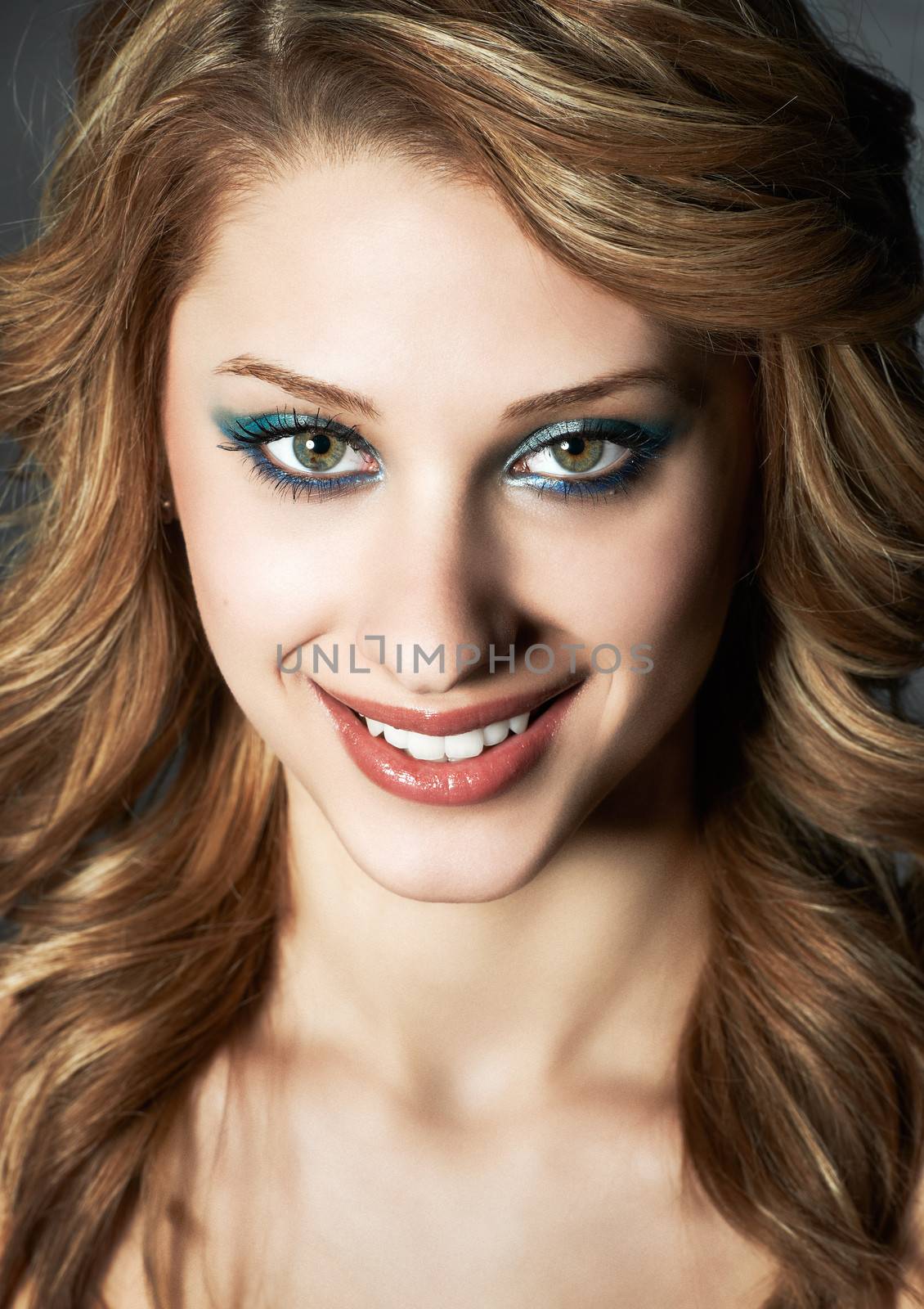 Studio head-shot of smiling young girl caucasian white